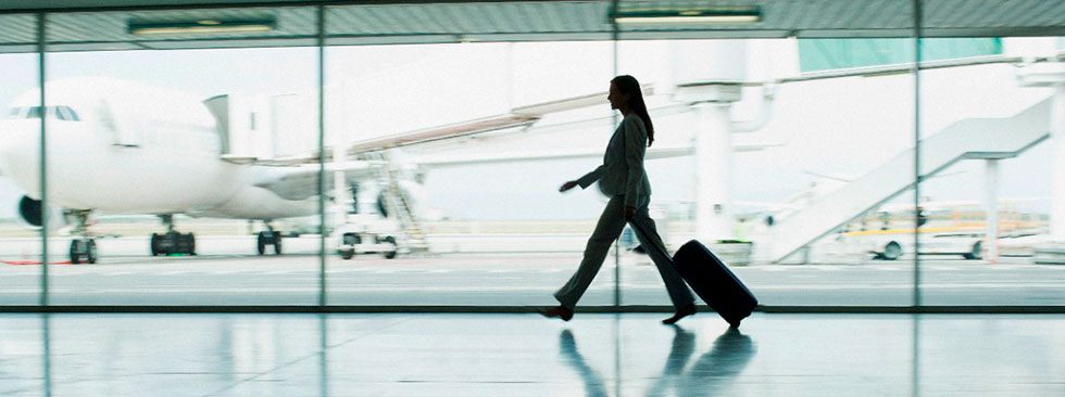 Traveler walking in an airport that uses computer vision